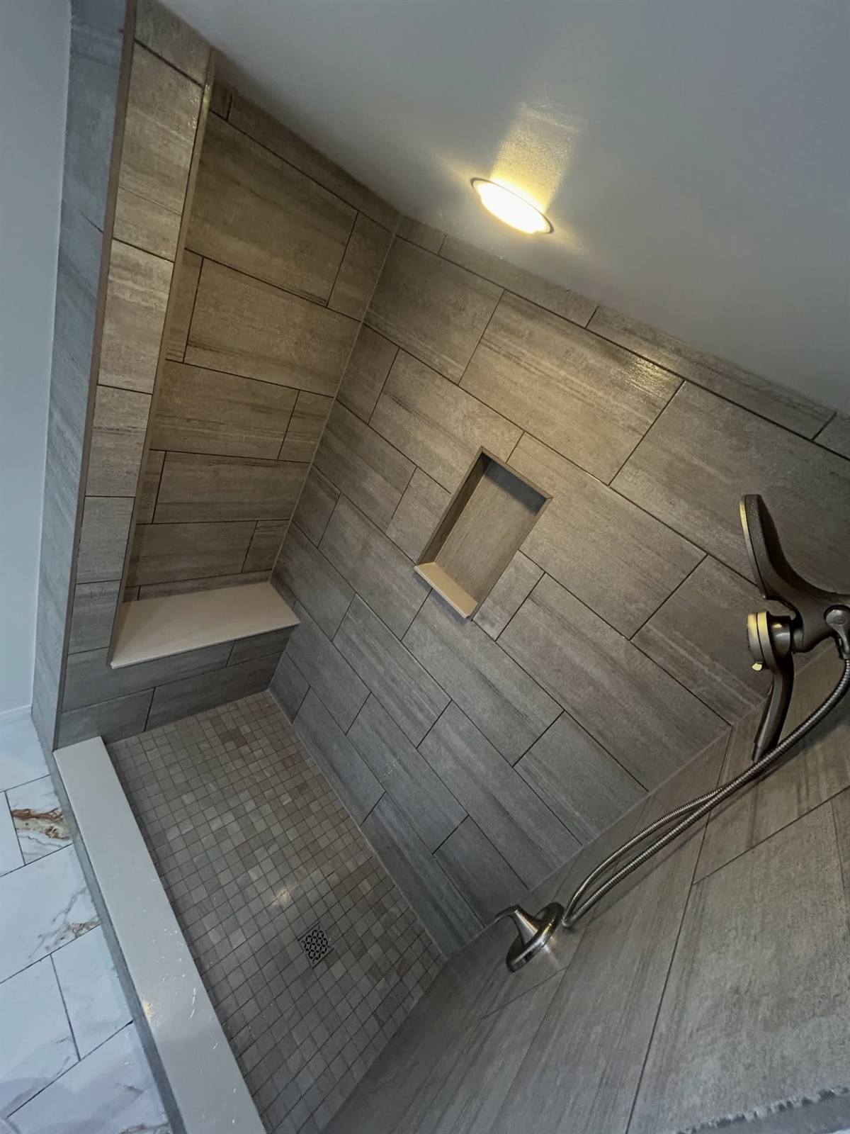 Tiled bathroom renovation with custom shower in Kingston, Ontario